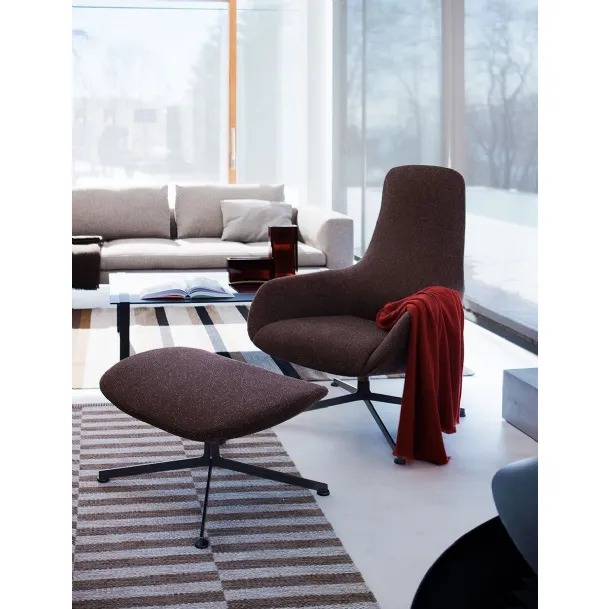 Kent swivel armchair in fabric with footrest by Zanotta