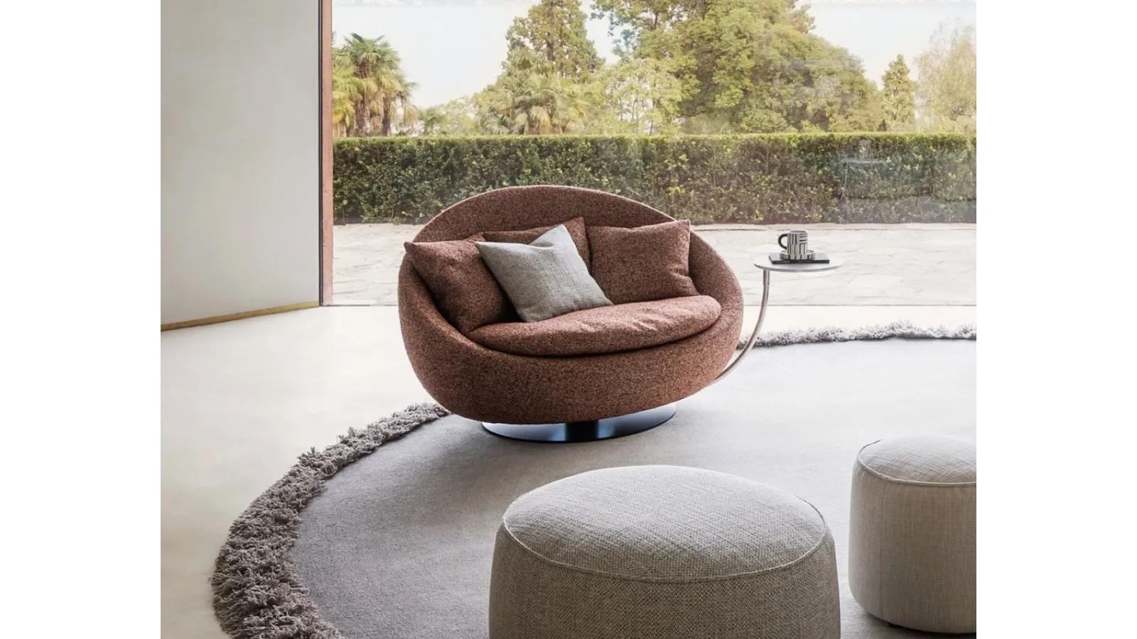 Maxi Swivel Armchair Lacoon in upholstered fabric by Desirèe