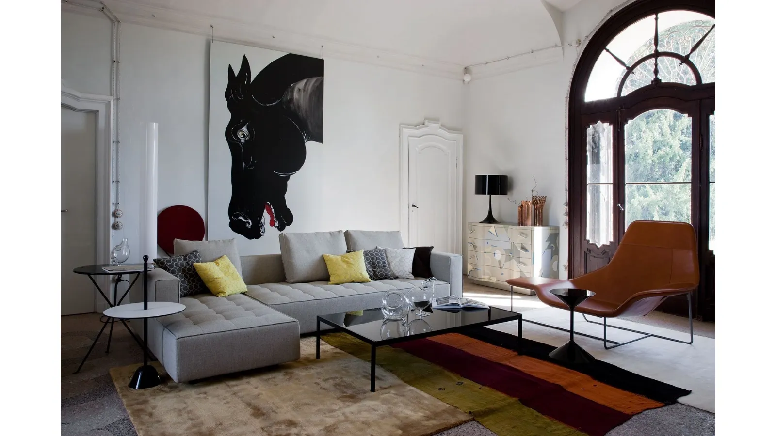 Lama armchair in leather with a painted steel frame by Zanotta