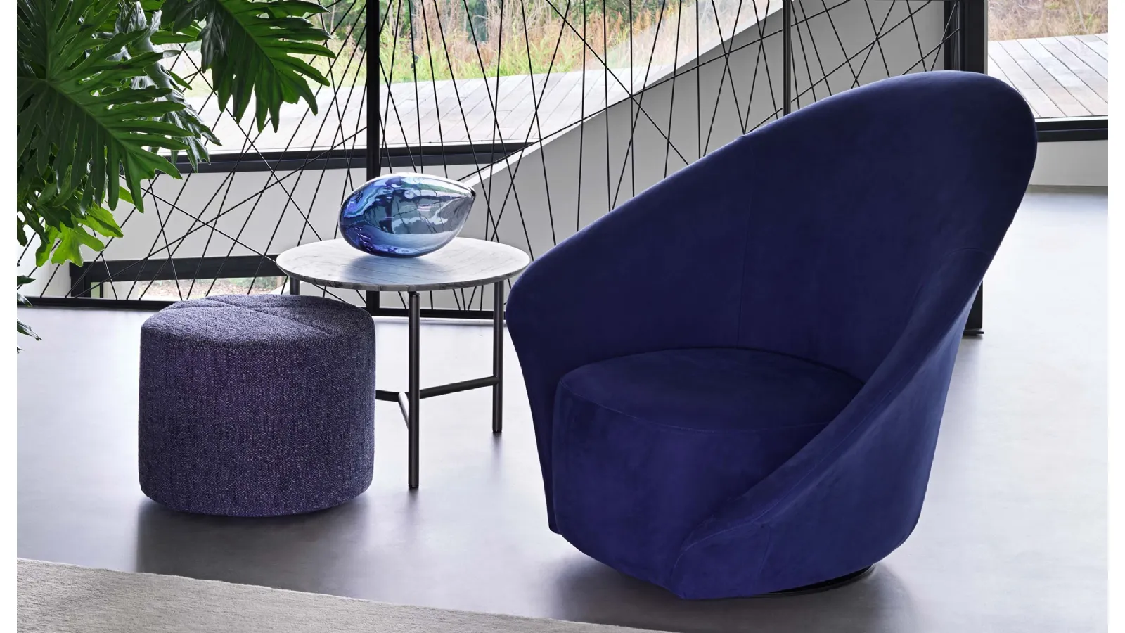 Flou Lilia fabric swivel armchair with a flower-like appearance and asymmetrical armrests