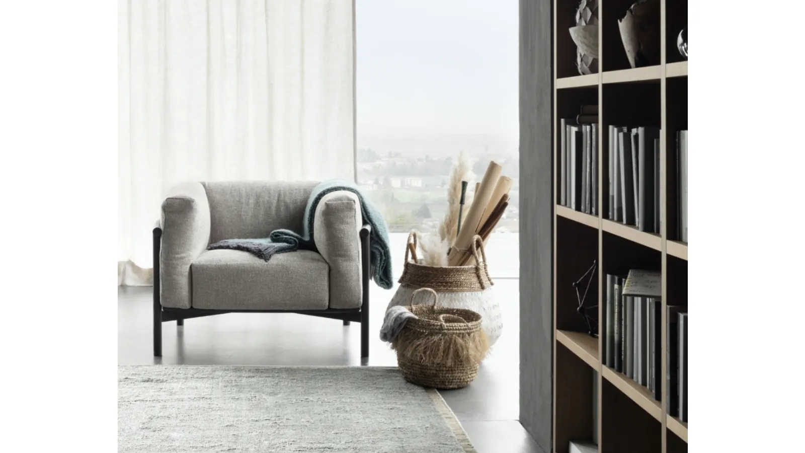 Taiki upholstered armchair by Lema