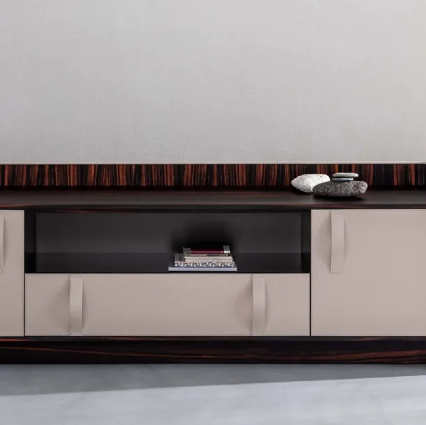 Madia Gentleman with a curved plywood structure, externally covered in white leather, internally in ebony with a Flou ebony top