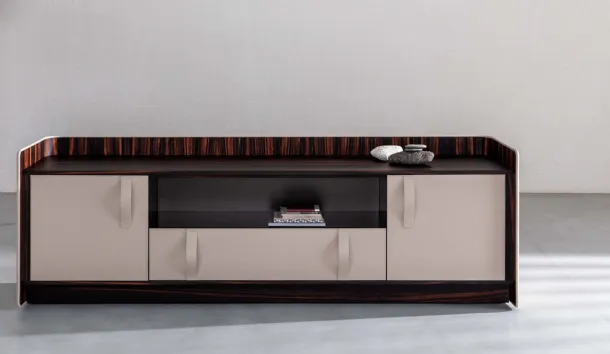 Madia Gentleman with a curved plywood structure, externally covered in white leather, internally in ebony with a Flou ebony top
