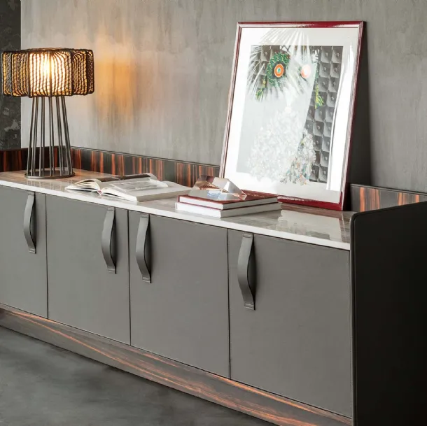 Madia Gentleman with a curved plywood structure, externally covered in grey leather, internally in ebony with a Flou marble top