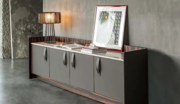 Madia Gentleman with a curved plywood structure, externally covered in grey leather, internally in ebony with a Flou marble top