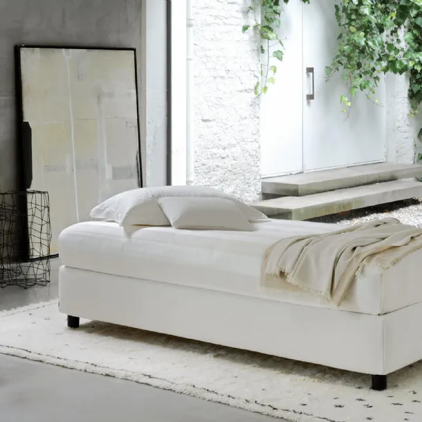 Single bed in fabric with Sommier storage by Flou