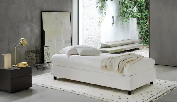 Single bed in fabric with Sommier storage by Flou