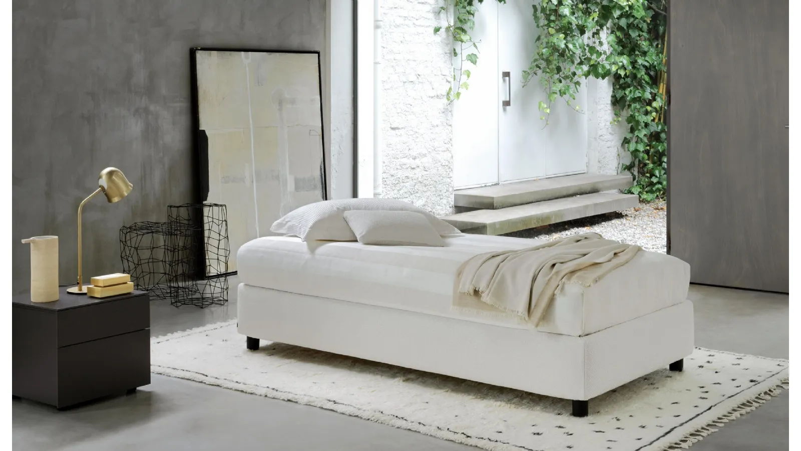 Single bed in fabric with Sommier storage by Flou