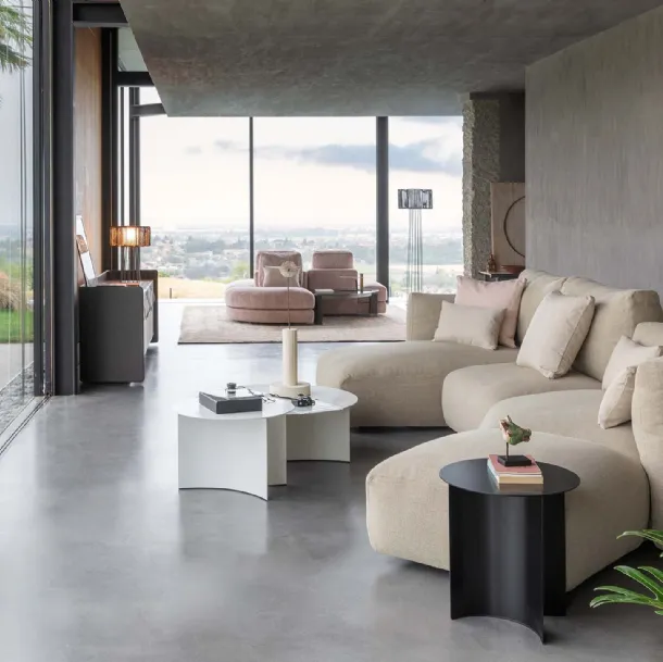 Upholstered fabric sofa with soft and curved lines and a Fiocco peninsula by Flou