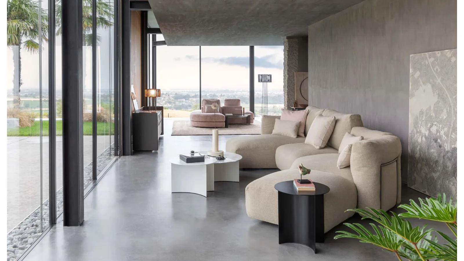 Upholstered fabric sofa with soft and curved lines and a Fiocco peninsula by Flou