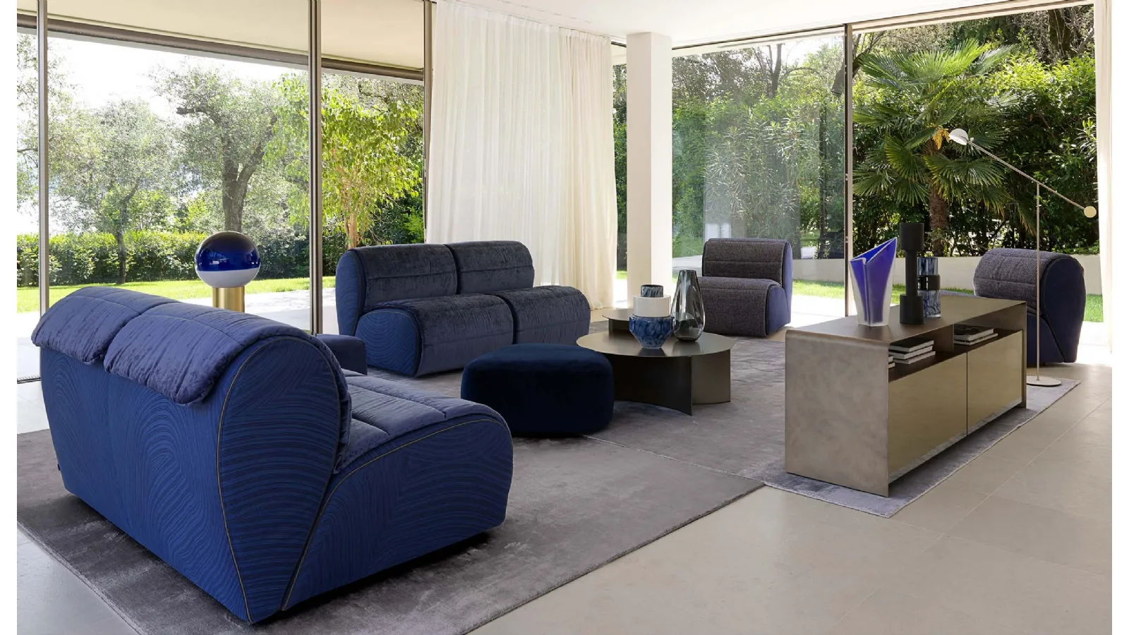 Fabric sofa with soft and comfortable seats inspired by the shape of flower petals Flora by Flou