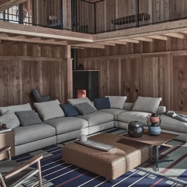 Harper fabric corner sofa with leather-covered armrests by Flexform