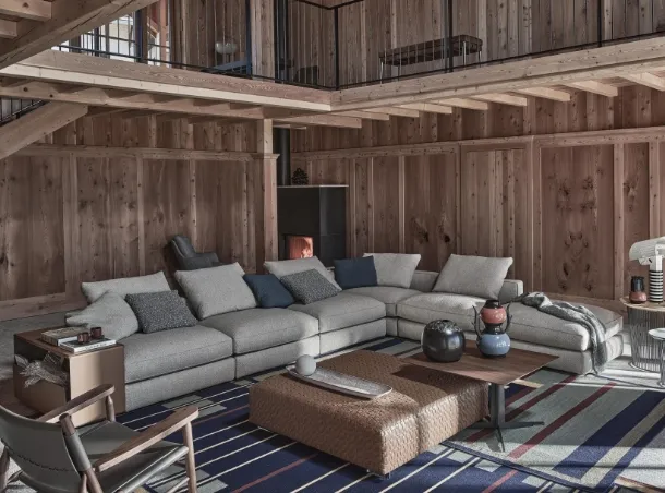 Harper fabric corner sofa with leather-covered armrests by Flexform