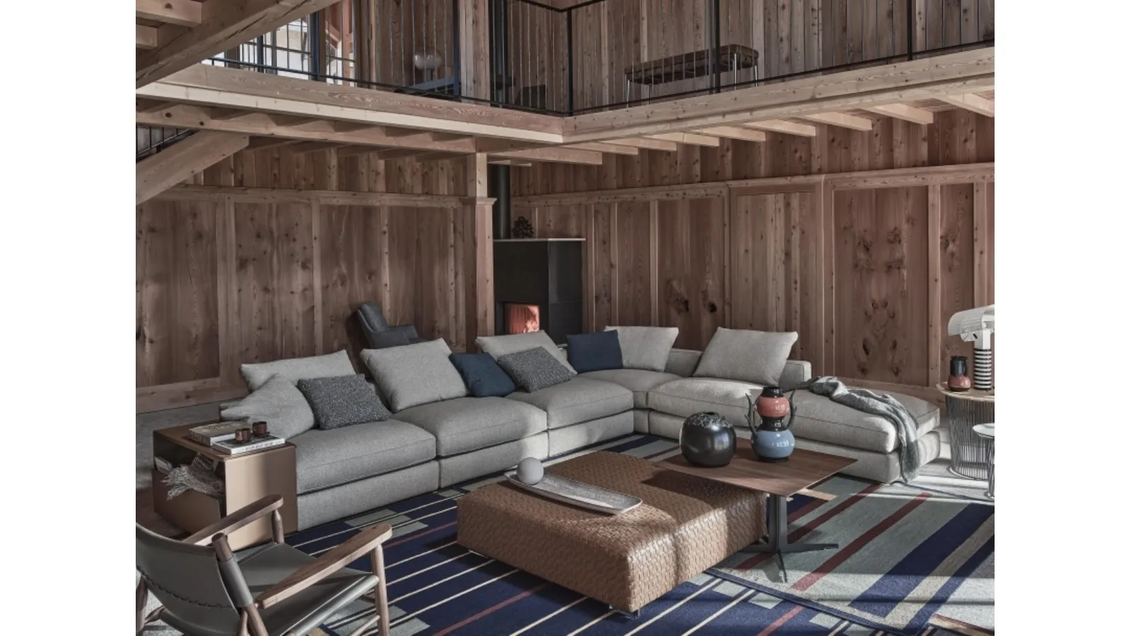 Harper fabric corner sofa with leather-covered armrests by Flexform