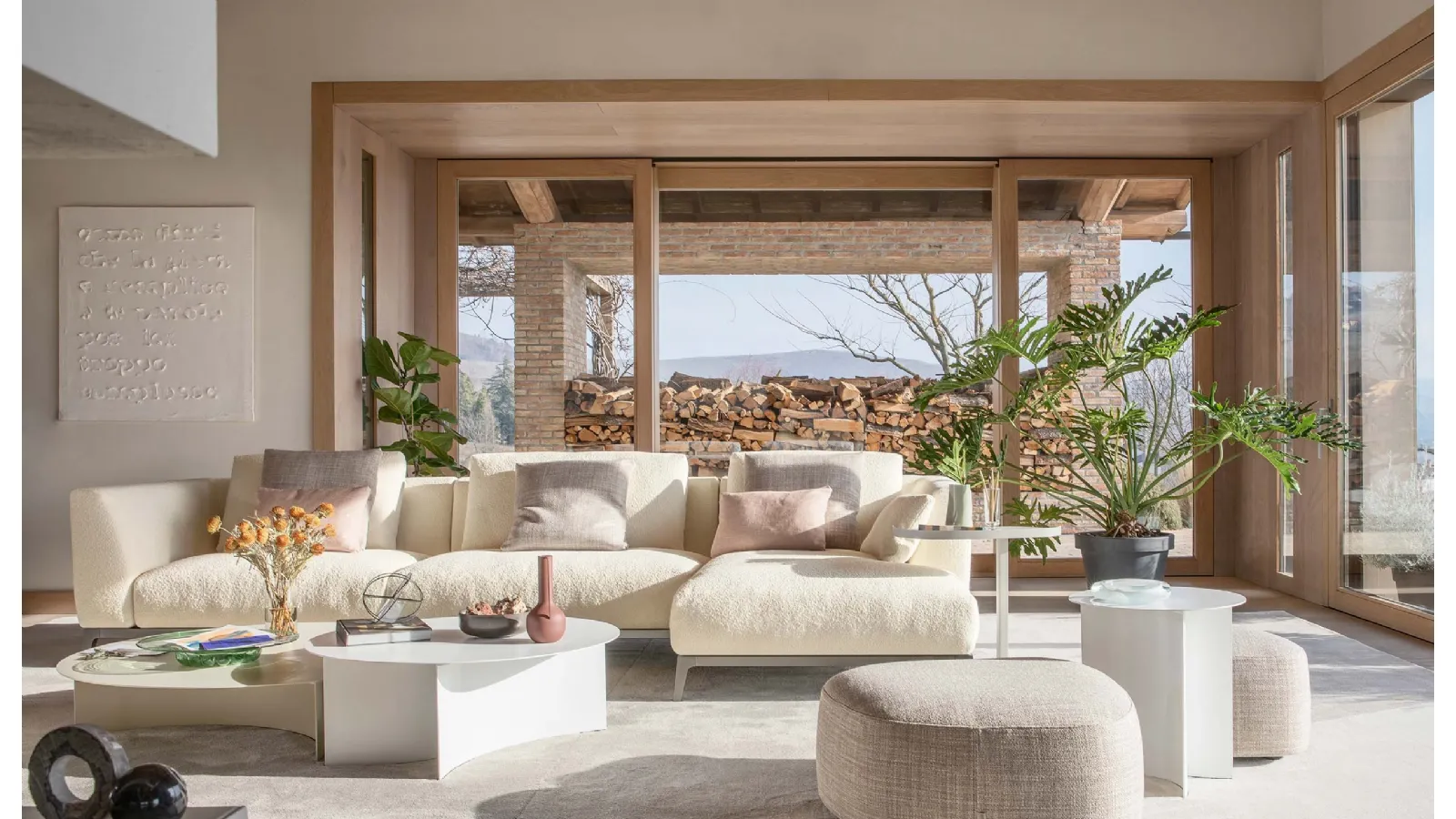 Fabric sofa with metal legs and Oliver peninsula by Flou