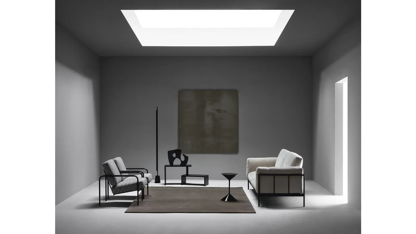 Linear fabric sofa with metal structure by Zanotta