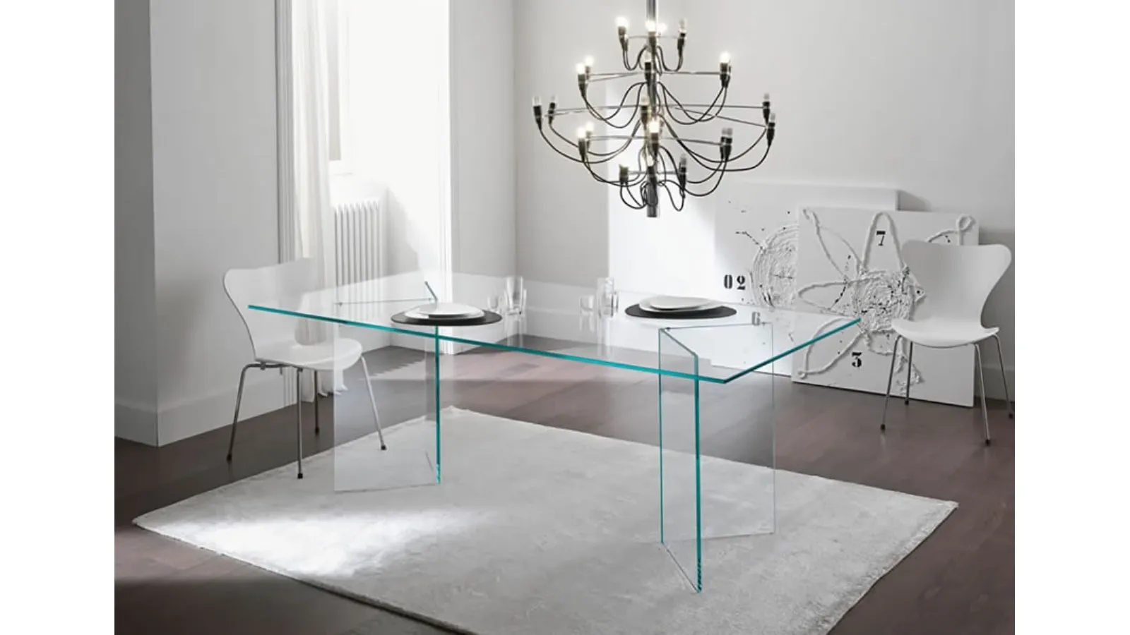 Glass table with a structure composed of two symmetrical Bacco supports by Tonelli