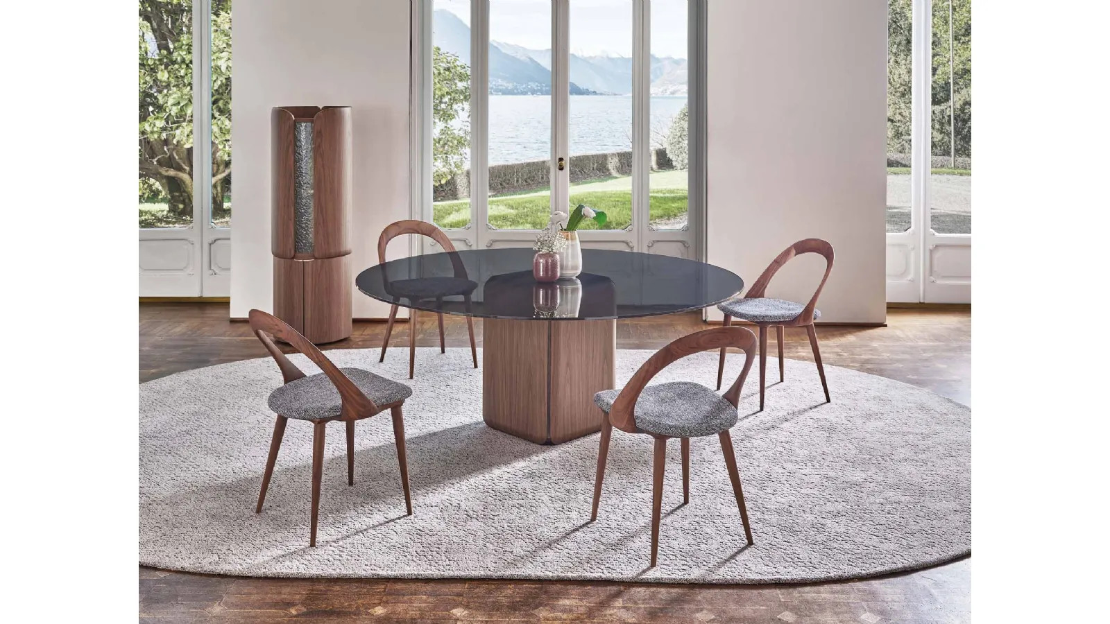 Bay round table with glass top by Porada