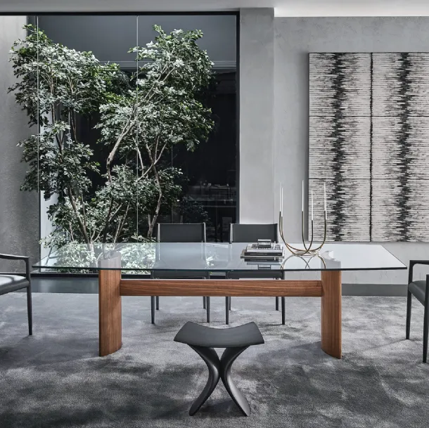 Table with a glass top and two half-moon bases in Canaletto walnut, joined by a central wooden beam from Porada's Beam collection