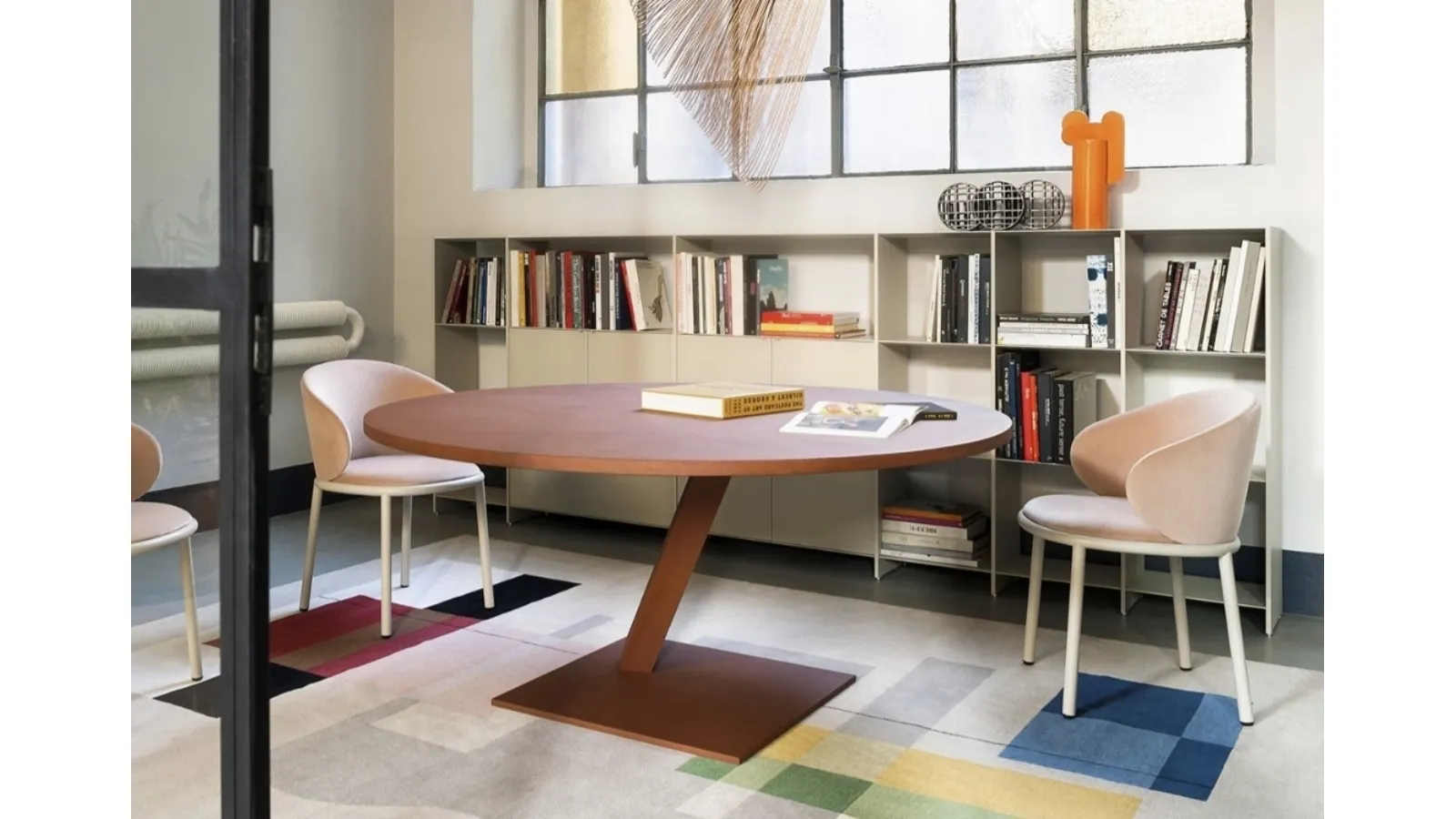 Round Element table in red cement material by Desalto