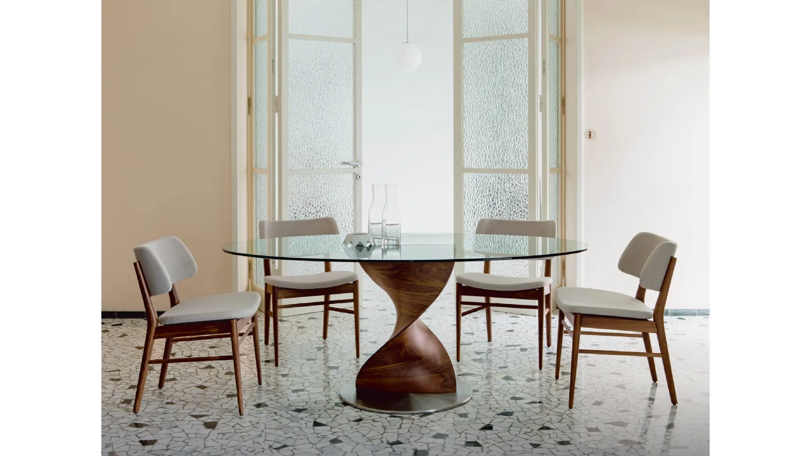 Round glass table with Elika base in canaletto walnut by Porada
