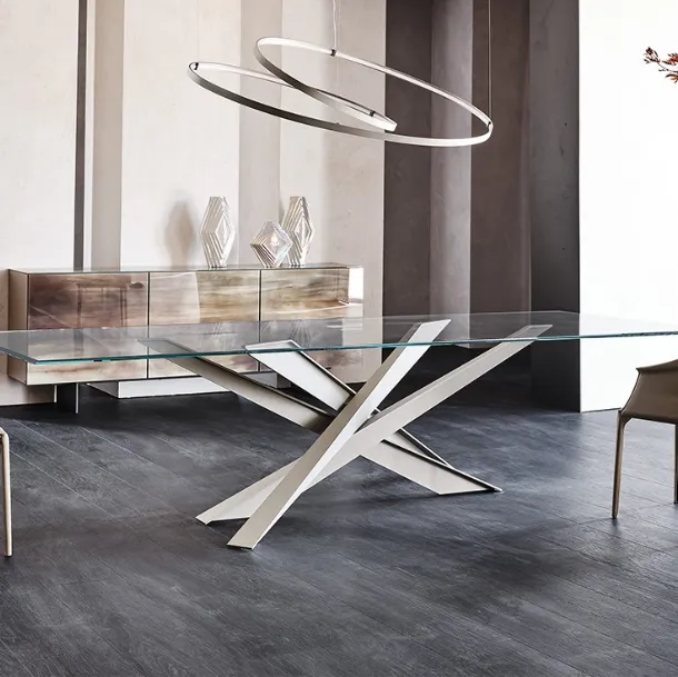 Table with sculptural lines and Lancer glass top by Cattelan Italia