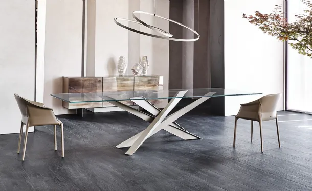 Table with sculptural lines and Lancer glass top by Cattelan Italia