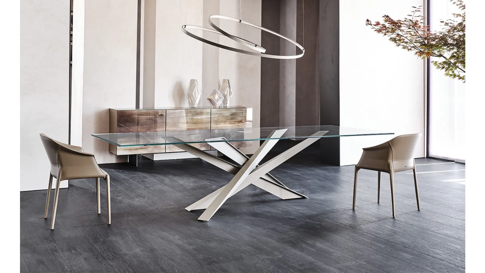 Table with sculptural lines and Lancer glass top by Cattelan Italia