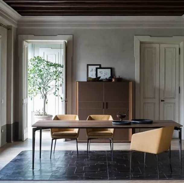 Chrome aluminum table with a Liuto walnut top by Alivar