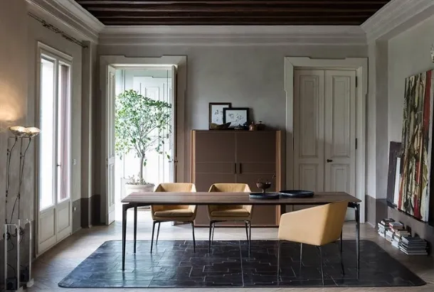 Chrome aluminum table with a Liuto walnut top by Alivar