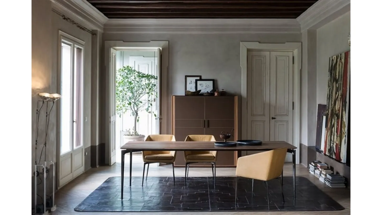 Chrome aluminum table with a Liuto walnut top by Alivar