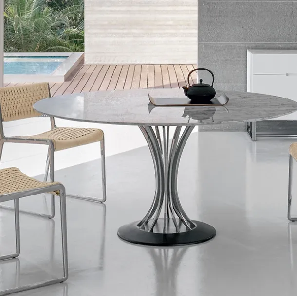 Round table with marble top, chrome steel legs, and cast iron base by Alivar