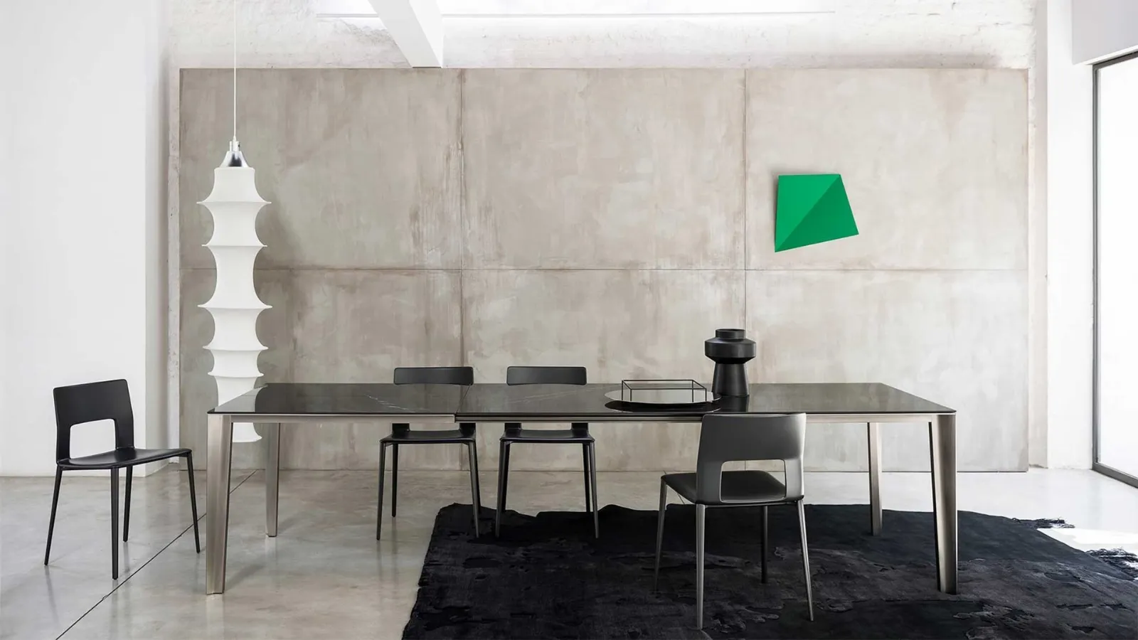 Skin extendable table with ceramic top and aluminum frame by Desalto