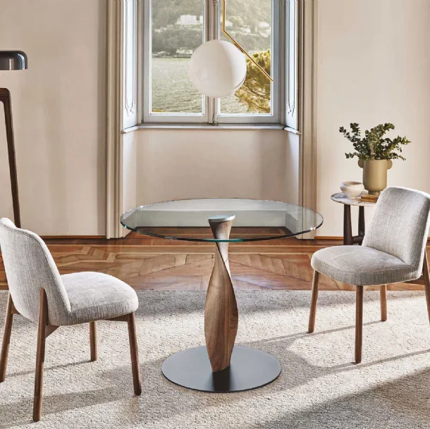 Round table with glass top and solid wood base Spin by Porada