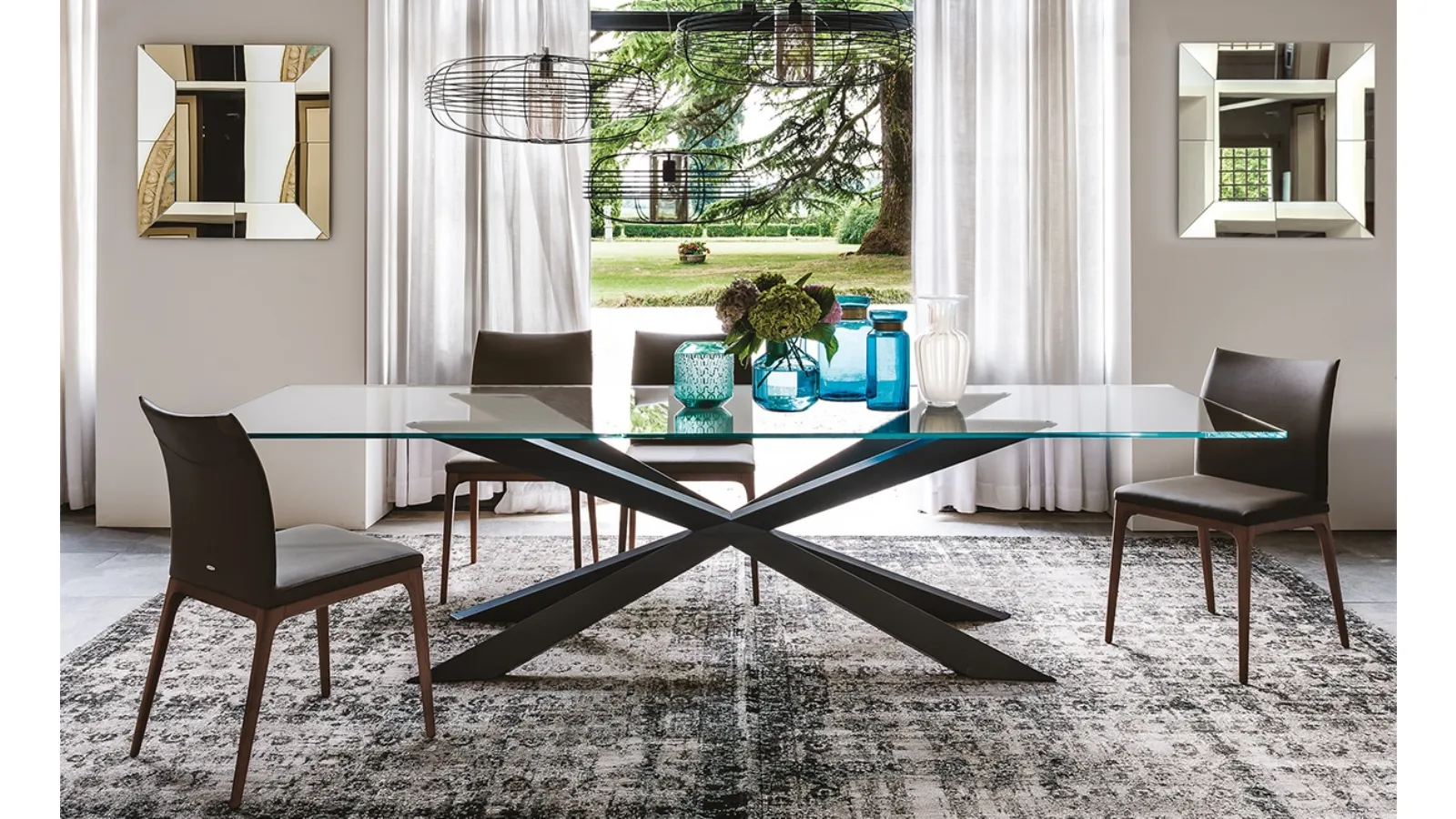 Table with glass top and Spyder steel base by Cattelan Italia