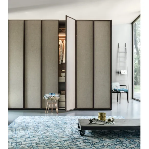 Wardrobe with swing doors upholstered in Lema's Dandy fabric