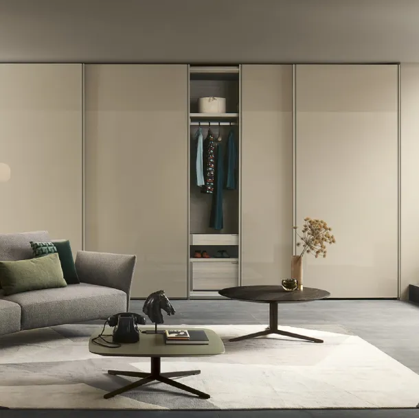 Custom wardrobe with sliding lacquered glass doors in Emery by Lema