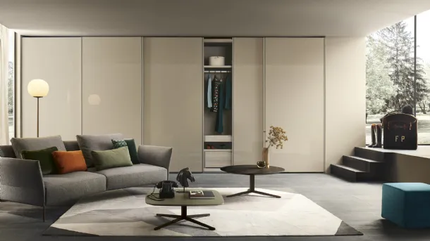 Custom wardrobe with sliding lacquered glass doors in Emery by Lema