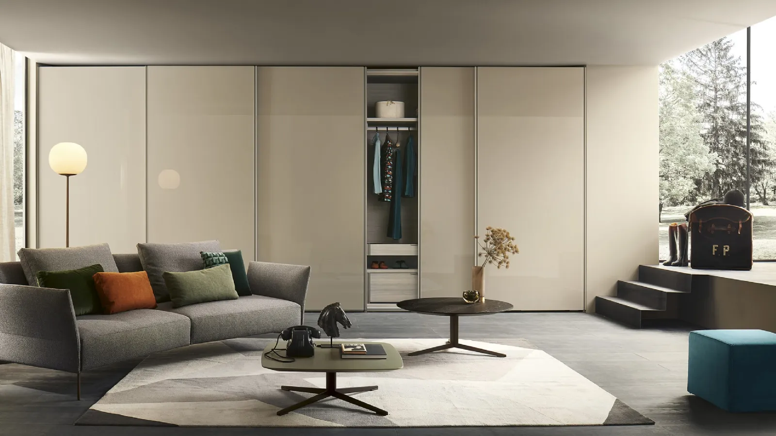 Custom wardrobe with sliding lacquered glass doors in Emery by Lema